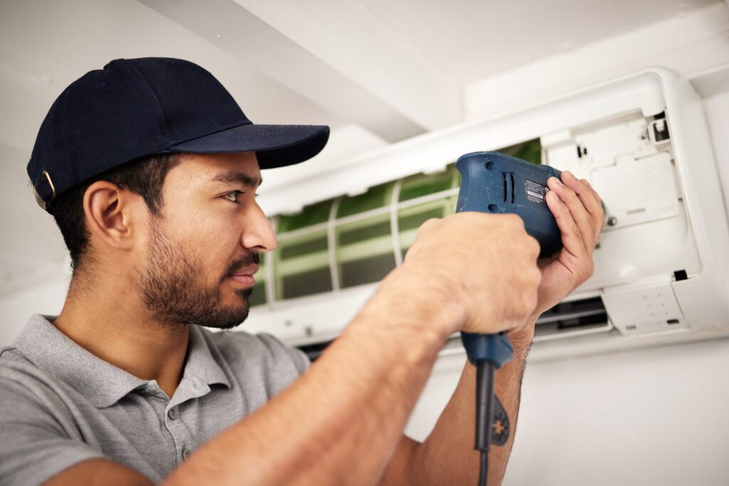 maintenance-air-conditioning-service-man-with-drill-working-ventilation-filter-ac-repair-contractor-handyman-electric-aircon-machine-expert-problem-solving-cleaning-dust-tools-min